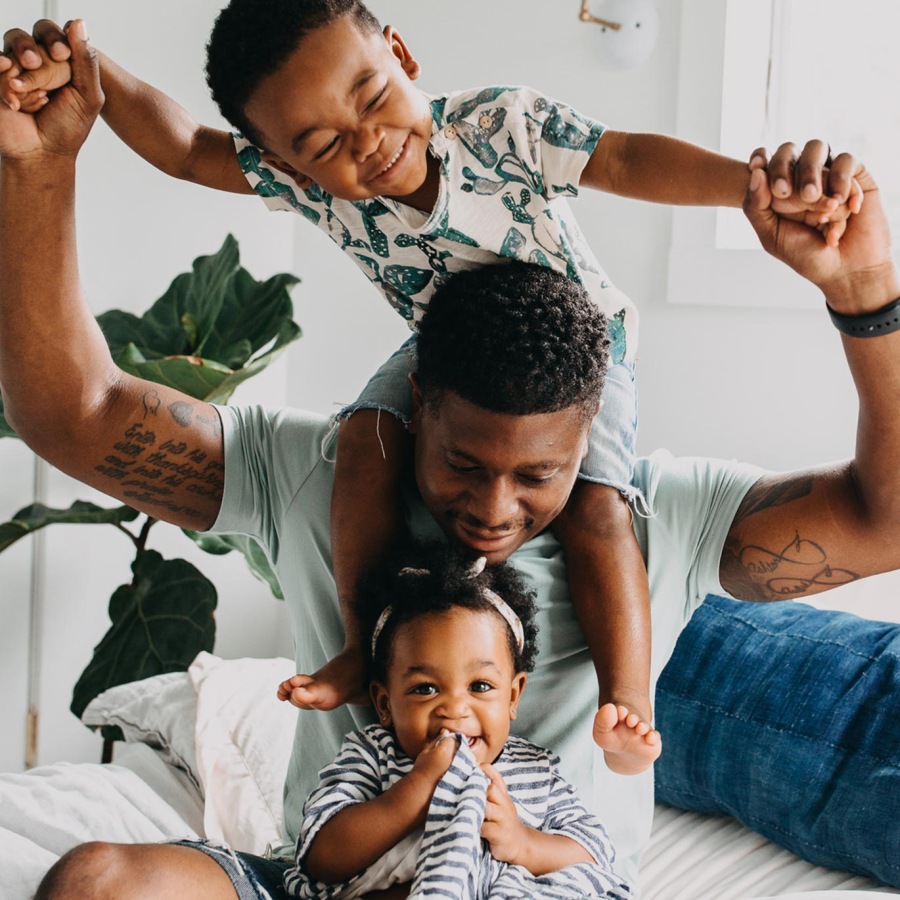 kids playing with their father